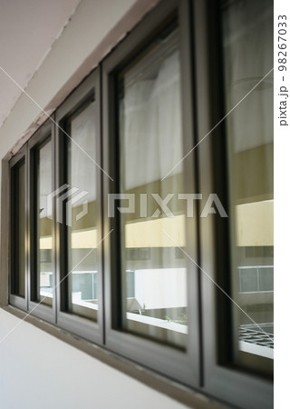 Modern building with tinted windows. Urban architecture Modern building with tinted windows. Urban architecture 98267033