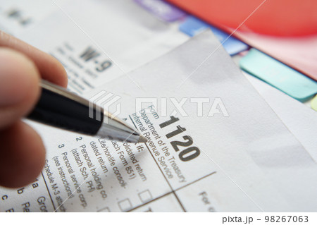 many US tax form on table  98267063