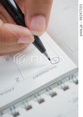 marking January 1 with a black color pen marking January 1 with a black color pen 98267503
