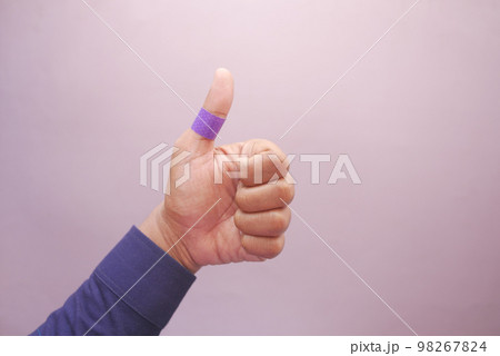 blue color adhesive bandage on hand  98267824
