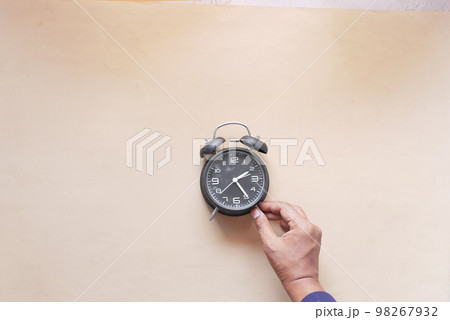 old alarm clock on color background. 98267932