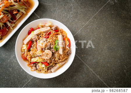 Instant noodles spicy salad on plate 98268587