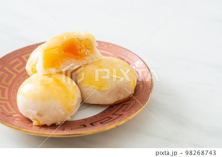 Chinese pastry moon cake with salted egg peanut or Spring Roll pastry with nuts and salted eggs Chinese pastry moon cake with salted egg peanut or Spring Roll pastry with nuts and salted eggs 98268743