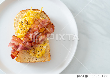 bread toast with scramble egg and bacon bread toast with scramble egg and bacon 98269159