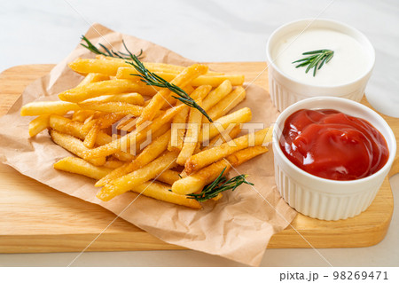 French fries with sour cream and ketchup 98269471