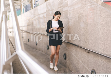 Adult business working asian woman interactive digital tablet for corporate with team via online. Adult business working asian woman interactive digital tablet for corporate with team via online. 98272634