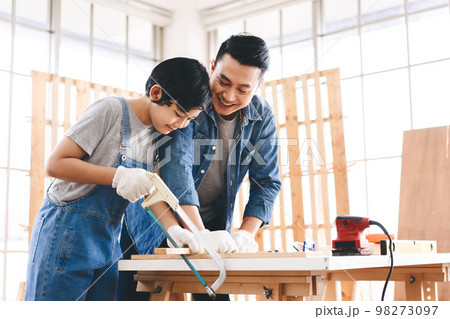 Southeast asian family father and son diy or repair for crafts skill at home workshop Southeast asian family father and son diy or repair for crafts skill at home workshop 98273097