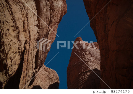 Bottom-up view to Abstract Rock formation at plateau Ennedi aka stone forest in Chad 98274179