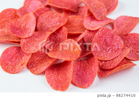 Red chips with hot pepper taste on a white background. Beer snack. 98274410