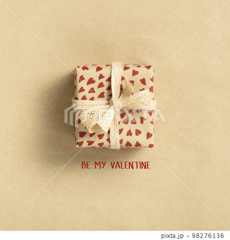 Eco friendly zero waste Valentine's day composition with gift box in craft recycling paper, top view, flat lay 98276136