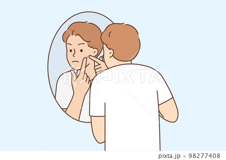 Young man stressed with pimple on face  98277408