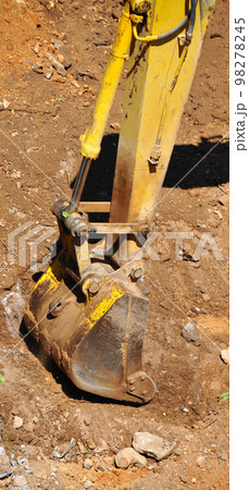 Excavator continues to work at the construction site Excavator continues to work at the construction site 98278245