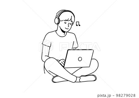 Guy sitting on grass with laptop and headphones Guy sitting on grass with laptop and headphones 98279028