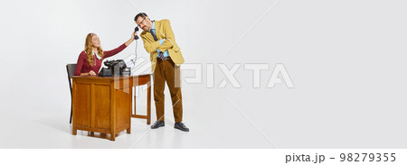 Woman, assistant sitting at the table and giving phone to her boss, businessman. Partnership, professional talks. Banner, flyer 98279355