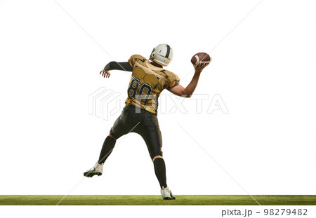 Throwing ball. Man, american football player in uniform playing, training over white studio background. Concept of sport, competition 98279482