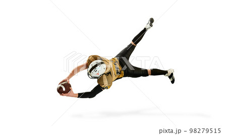 Flying, catching ball. Man, american football player in motion, training over white studio background. Top view. Concept of sport, competition 98279515
