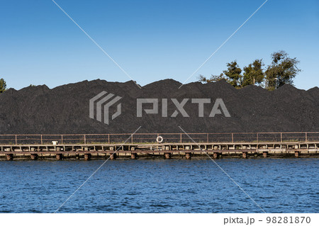 Piles of Coal at River Waterfront 98281870