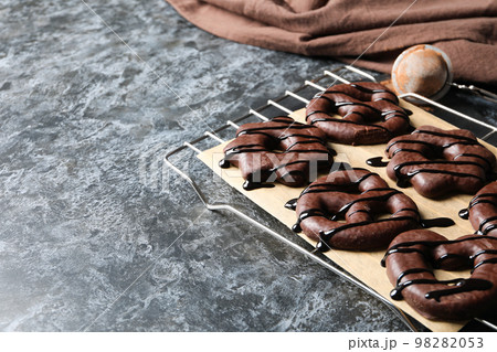 Concept of tasty bakery, gingerbread cookies in chocolate, space for text Concept of tasty bakery, gingerbread cookies in chocolate, space for text 98282053