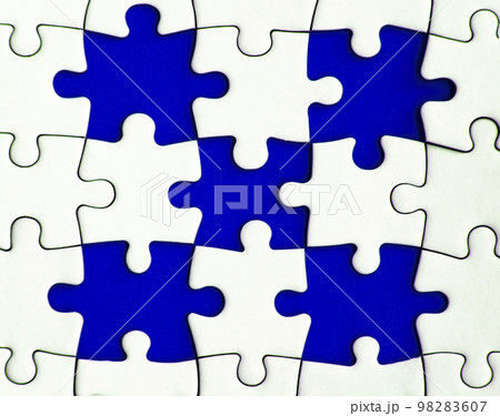 Missing jigsaw puzzle on blue background with customizable space for text or ideas. Copy space Missing jigsaw puzzle on blue background with customizable space for text or ideas. Copy space 98283607