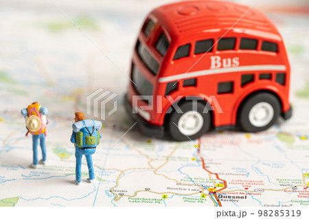 Bangkok, Thailand - January 20, 2022 Traveler with backpack walking to bus on map, transport travel tour concept. 98285319