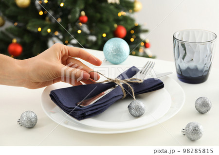 Concept of Happy New Year, beautiful and cozy table setting Concept of Happy New Year, beautiful and cozy table setting 98285815
