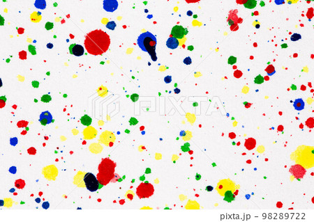 Paint splatters on bright material. Watercolor on white paper. Paint splatters on bright material. Watercolor on white paper. 98289722