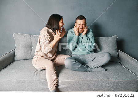 Angry woman screaming to her husband Angry woman screaming to her husband 98291022