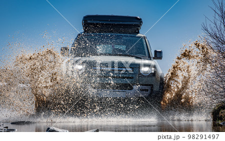 Off road tourist car rides off-road in the highlands. Expedition travel and vacation, adventures in remote areas. 98291497