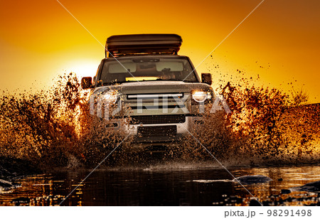 Off road tourist car rides off-road in the highlands. Expedition travel and vacation, adventures in remote areas. Off road tourist car rides off-road in the highlands. Expedition travel and vacation, adventures in remote areas. 98291498