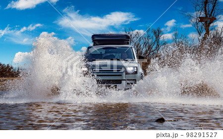 Off road tourist car rides off-road in the highlands. Expedition travel and vacation, adventures in remote areas. Off road tourist car rides off-road in the highlands. Expedition travel and vacation, adventures in remote areas. 98291527