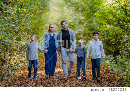 Portrait of happy family with kids in a forest. 98292256