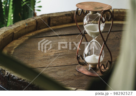 Sandglass on wooden bakground closeup. Time concept 98292527