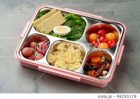 Lunch box with ready food on gray background Lunch box with ready food on gray background 98293178