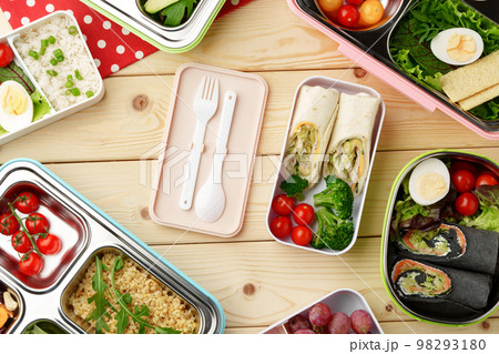 Containers with healthy food on wooden background top view. Containers with healthy food on wooden background top view. 98293180