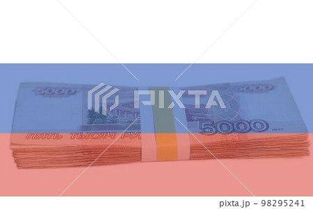 Money banknotes rubles on the Russian flag. 98295241