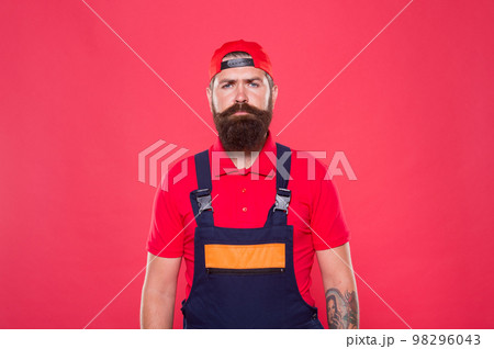 Real man. Handyman service. Man helpful laborer. Repair and renovation. Guy brutal bearded worker in uniform. Builder regular worker. Handyman services concept. Handyman professional occupation Real man. Handyman service. Man helpful laborer. Repair and renovation. Guy brutal bearded worker in uniform. Builder regular worker. Handyman services concept. Handyman professional occupation 98296043