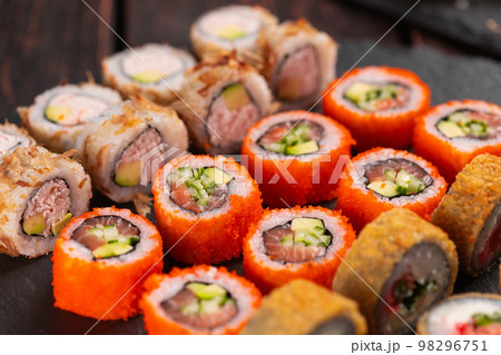 Rolls set with fish shrimp and caviar sushi with chopsticks - asian food and japanese cuisine concept 98296751