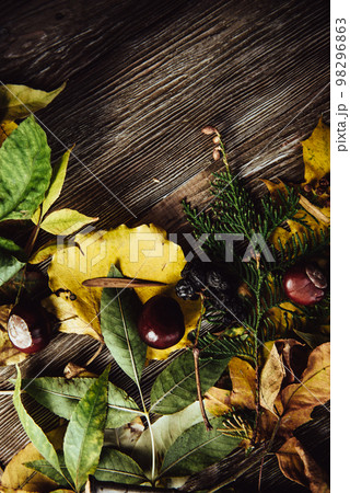 Autumn wooden background with maple leaves with copy space Autumn wooden background with maple leaves with copy space 98296863