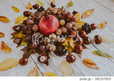 Autumn still life. apple, pumpkin, pomegranate, viburnum, leaves. Flatlay background 98297003