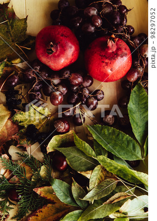 Autumn still life. apple, pumpkin, pomegranate, viburnum, leaves. Flatlay background 98297052