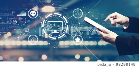 Social media theme with businessman using a tablet Social media theme with businessman using a tablet 98298149