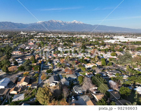 Aerial view of Ontario city in California with mountains in the background 98298603