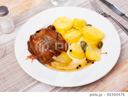 Portion of duck confit on table Portion of duck confit on table 98300476