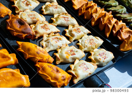 Colorful empanadas in pastry shop Colorful empanadas in pastry shop 98300493