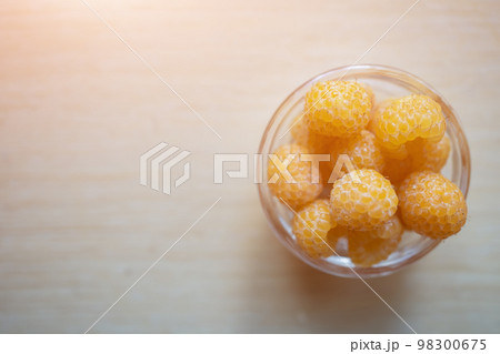 fresh healthy raspberry in glass plate on wooden background fresh healthy raspberry in glass plate on wooden background 98300675
