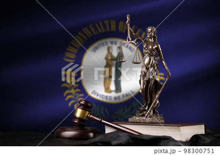 Kentucky US state flag with statue of lady justice, constitution and judge hammer on black drapery. Concept of judgement and guilt Kentucky US state flag with statue of lady justice, constitution and judge hammer on black drapery. Concept of judgement and guilt 98300751