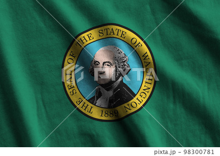 Washington US state flag with big folds waving close up under the studio light indoors. The official symbols and colors in banner 98300781