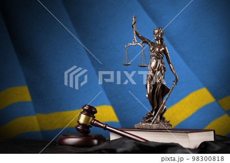 Aruba flag with statue of lady justice, constitution and judge hammer on black drapery. Concept of judgement and guilt 98300818