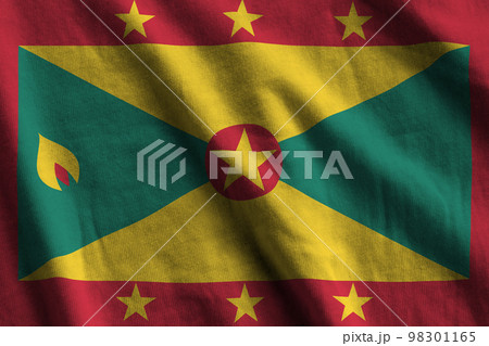 Grenada flag with big folds waving close up under the studio light indoors. The official symbols and colors in banner Grenada flag with big folds waving close up under the studio light indoors. The official symbols and colors in banner 98301165