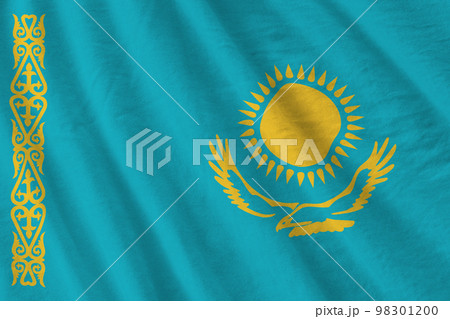 Kazakhstan flag with big folds waving close up under the studio light indoors. The official symbols and colors in banner 98301200
